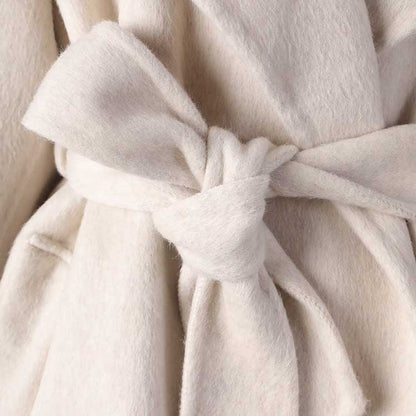 Elegant cream-colored mid-length wool coat stylish comfort with a tied waist for a chic look