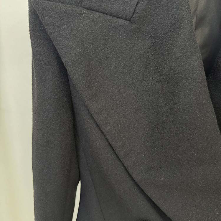 Minimalist double-breasted wool coat with a sleek design and tailored fit for a modern look