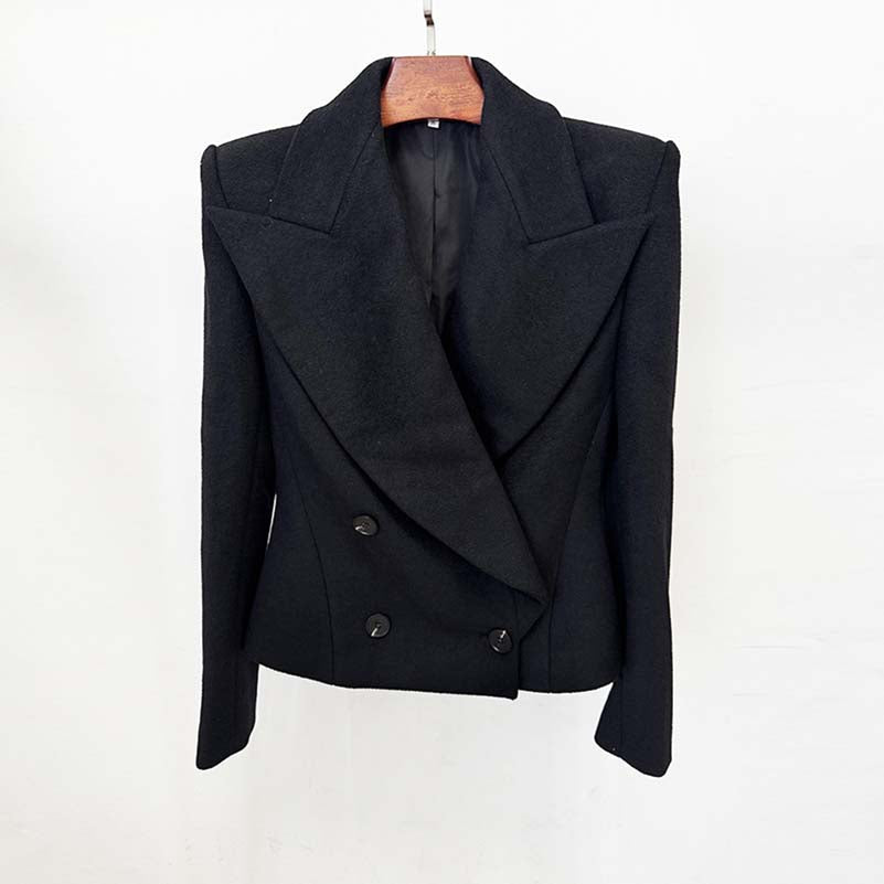 Stylish black minimalist double-breasted wool coat featuring a sharp collar and tailored fit