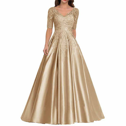 Elegant mother of the bride satin dress in gold with lace detailing and a flattering silhouette