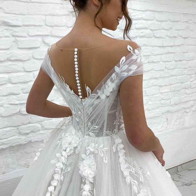 Elegant off the shoulder princess wedding dress with floral details and button back design