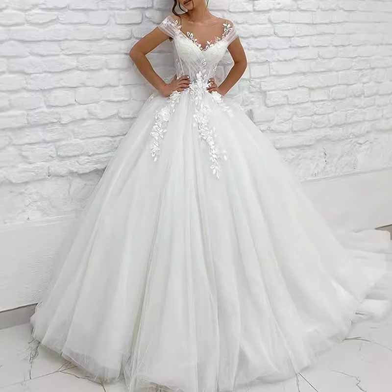 Elegant off the shoulder princess wedding dress with floral lace details and a full skirt