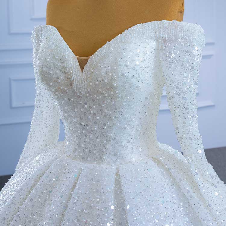 Off the shoulder sequin wedding dress featuring a stunning fitted bodice and elegant flared skirt