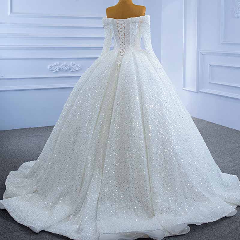 Elegant off the shoulder sequin wedding dress with a voluminous skirt and intricate back detailing