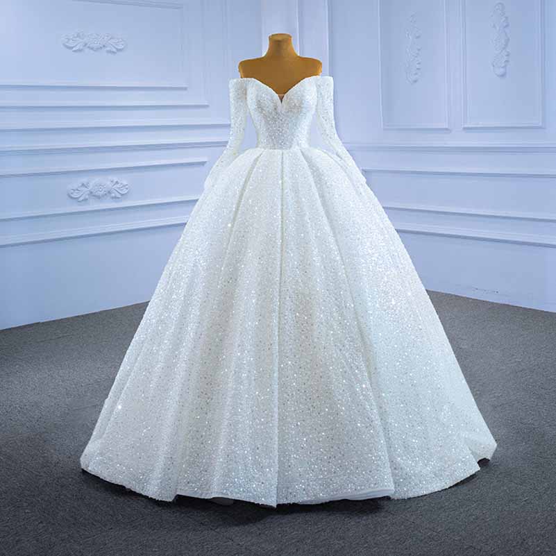 Elegant off the shoulder sequin wedding dress featuring a luxurious full skirt and fitted bodice