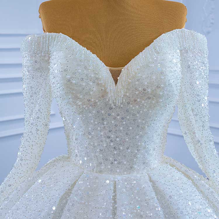 Elegant off the shoulder sequin wedding dress with a sweetheart neckline and shimmering details