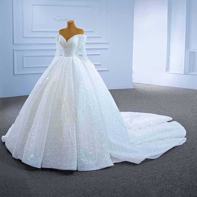 Off the shoulder sequin wedding dress with a voluminous skirt and elegant train for a stunning bridal look