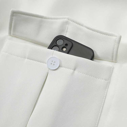 Close-up of off-white belted mini dress with pockets featuring a smartphone inside for convenient storage