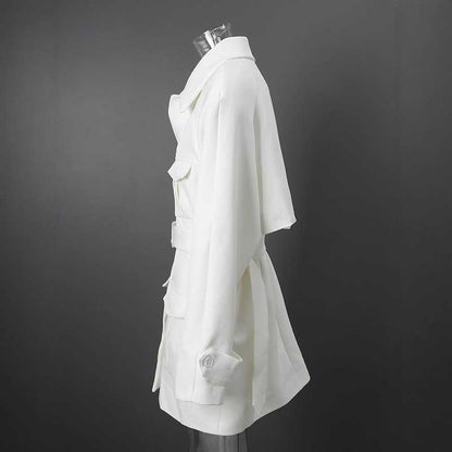Side view of off-white belted mini dress with pockets featuring a relaxed silhouette