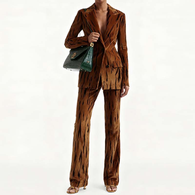 Stylish one button velvet pantsuit for women in brown with a chic pattern, paired with a handbag