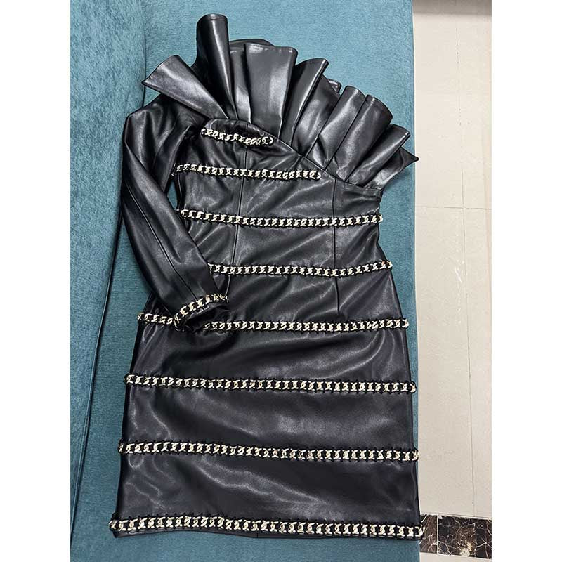 One shoulder faux leather mini dress with ruffled collar and decorative chain trim