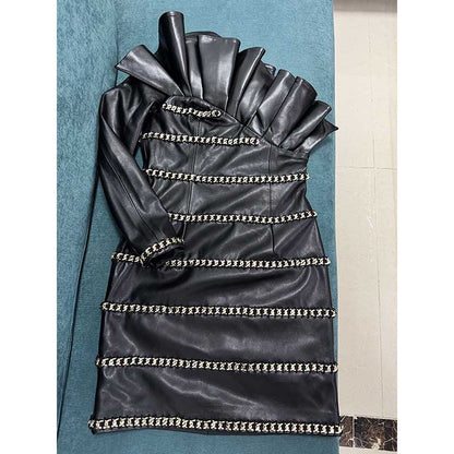 One shoulder faux leather mini dress with ruffled collar and decorative chain trim