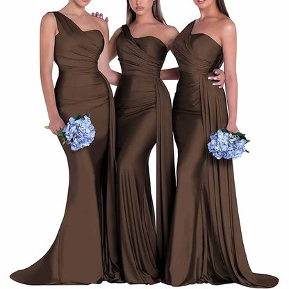 One shoulder satin bridesmaid dress in brown featured on three models holding blue bouquets