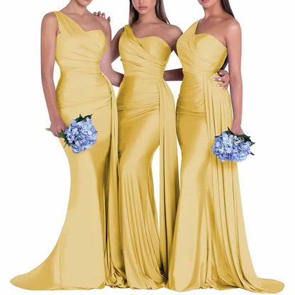 Three models in yellow one shoulder satin bridesmaid dress featuring elegant draping and a fitted silhouette