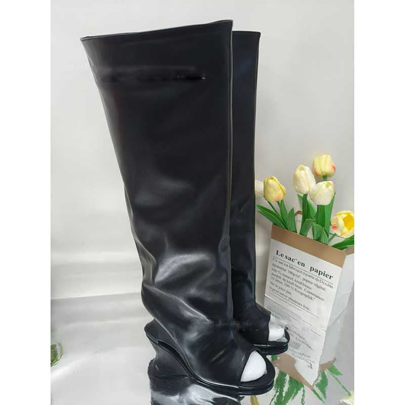 Stylish black open toe suede boots for women with a sleek design and a high wedge heel