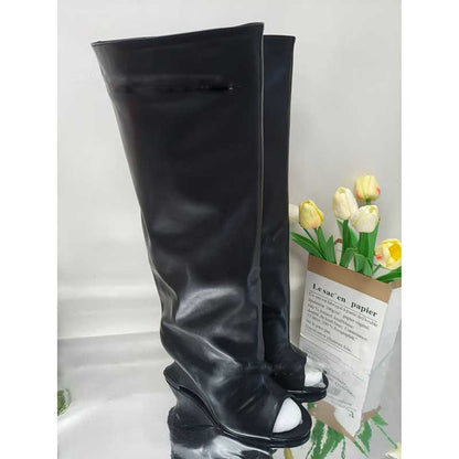 Stylish black open toe suede boots for women with a sleek design and a high wedge heel