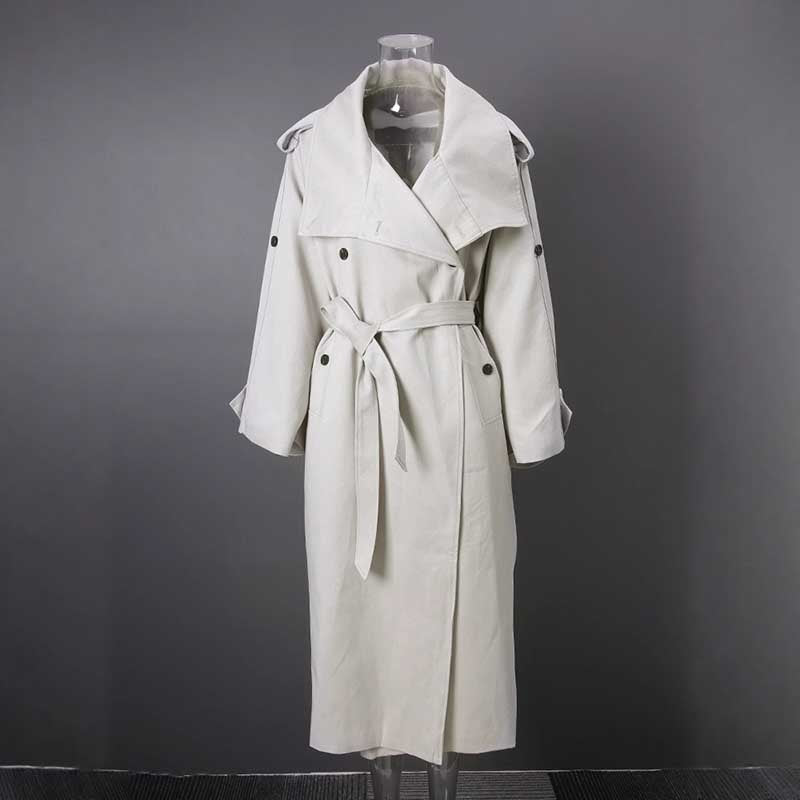 Oversize women's trench coat in light beige with a belted waist and stylish lapels