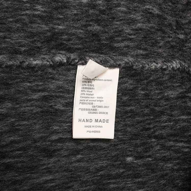 Oversized wool blend coat grey tag detailing with fabric composition and care instructions