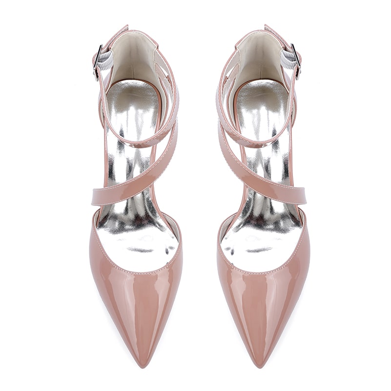 Elegant patent leather bridal heels in blush pink with a pointed toe and ankle straps