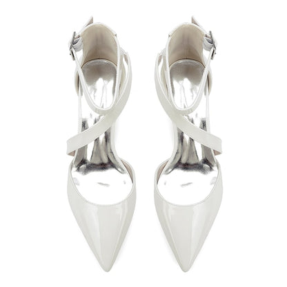Elegant white patent leather bridal heels with a stylish pointed toe and cross-strap design