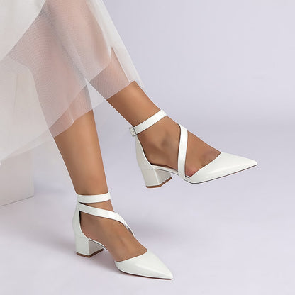 Stylish patent leather bridal heels with ankle straps and patterned block heels for weddings