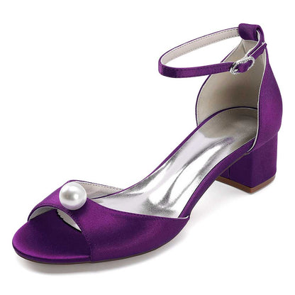 Elegant purple pearl block heel wedding sandals with an ankle strap and a stylish design