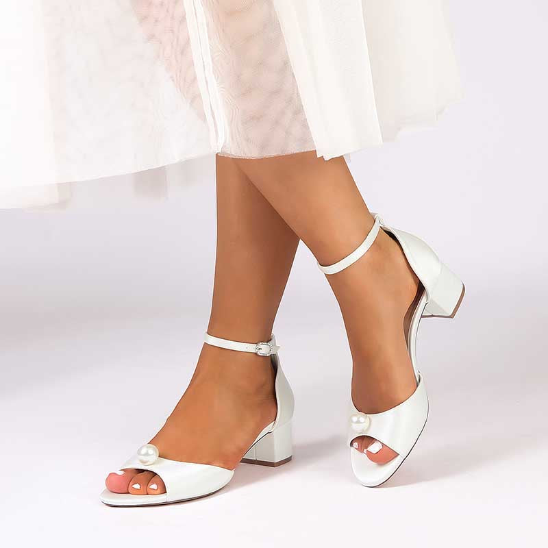 Elegant pearl block heel wedding sandals in white with open toe and ankle strap design