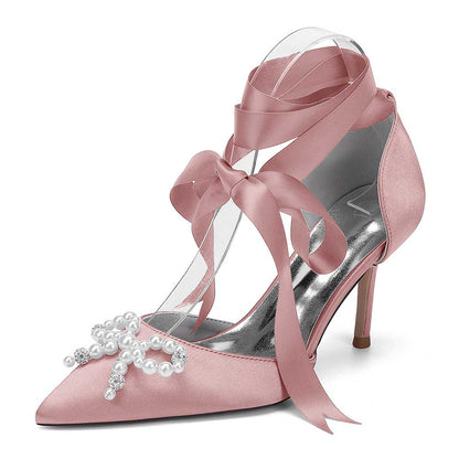 Elegant S&DCo. pearl bow bridal heels in pink satin with ankle ribbons and decorative pearls