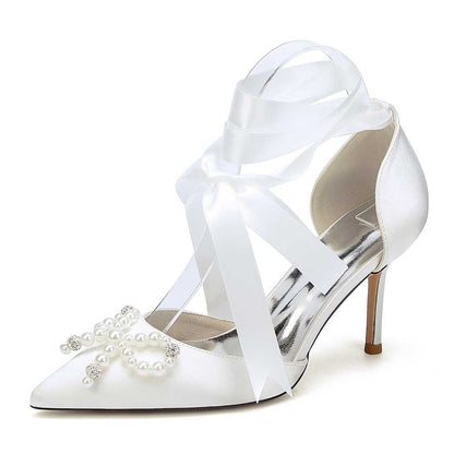 Elegant pearl bow bridal heels with satin finish and decorative pearl detail for wedding attire