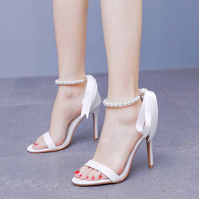 Elegant pearl bridal heels with satin ribbons and ankle straps for stylish brides on their special day