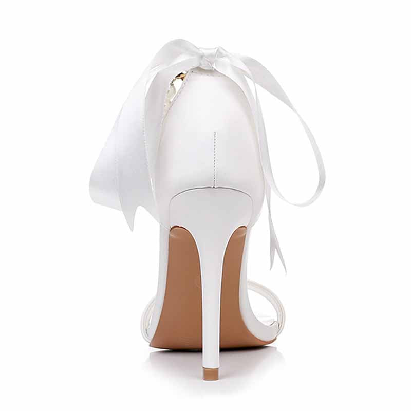 Elegant S&DCo. pearl bridal heels with a delicate ribbon detail for a stunning wedding look