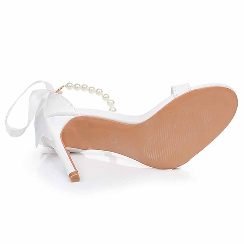 S&DCo. pearl bridal heels featuring a delicate pearl strap and elegant design for weddings
