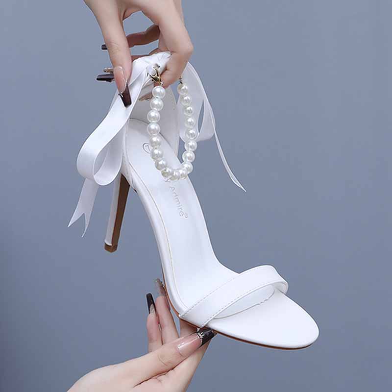 Elegant S&DCo. pearl bridal heels with ribbon detail and pearl embellishments for weddings