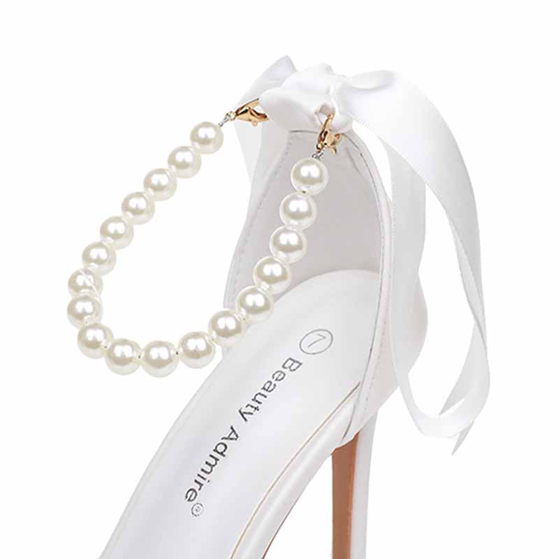 Elegant pearl bridal heels by S&DCo featuring a decorative pearl strap and satin bow