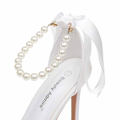Elegant pearl bridal heels by S&DCo featuring a decorative pearl strap and satin bow