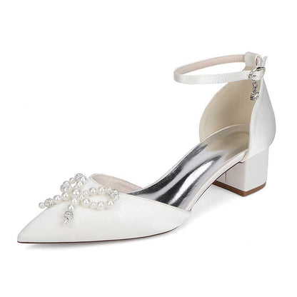 Elegant pearl embellished bridal heels with ankle strap and block heel for a stunning look