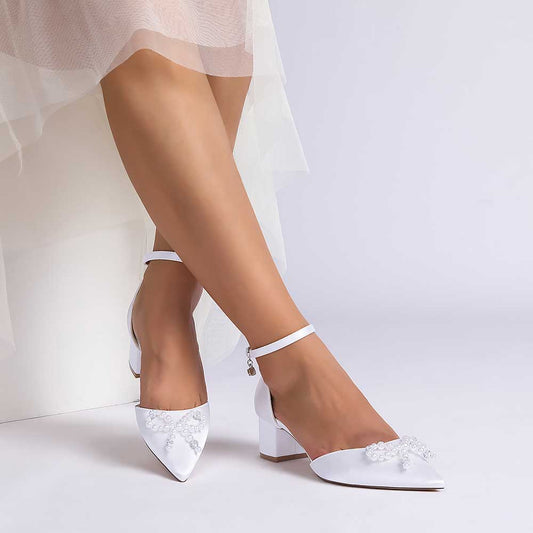 Pearl embellished bridal heels with ankle strap and elegant design for wedding occasions
