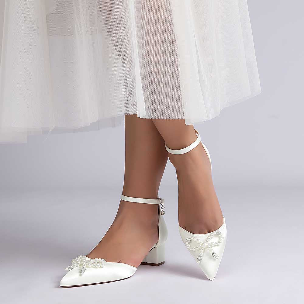 Elegant pearl embellished bridal heels with ankle strap and stylish pointed toe design