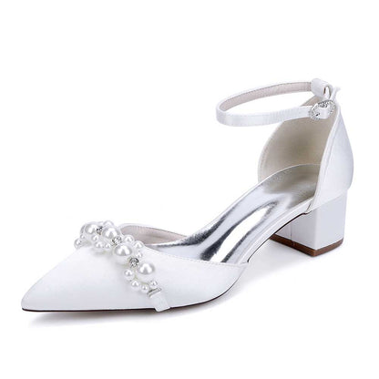 Elegant pearl embellished bride shoes with a pointed toe and ankle strap for a chic bridal look