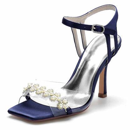 S&DCo. pearl embellished prom heels in navy blue with a clear strap and high stiletto heel