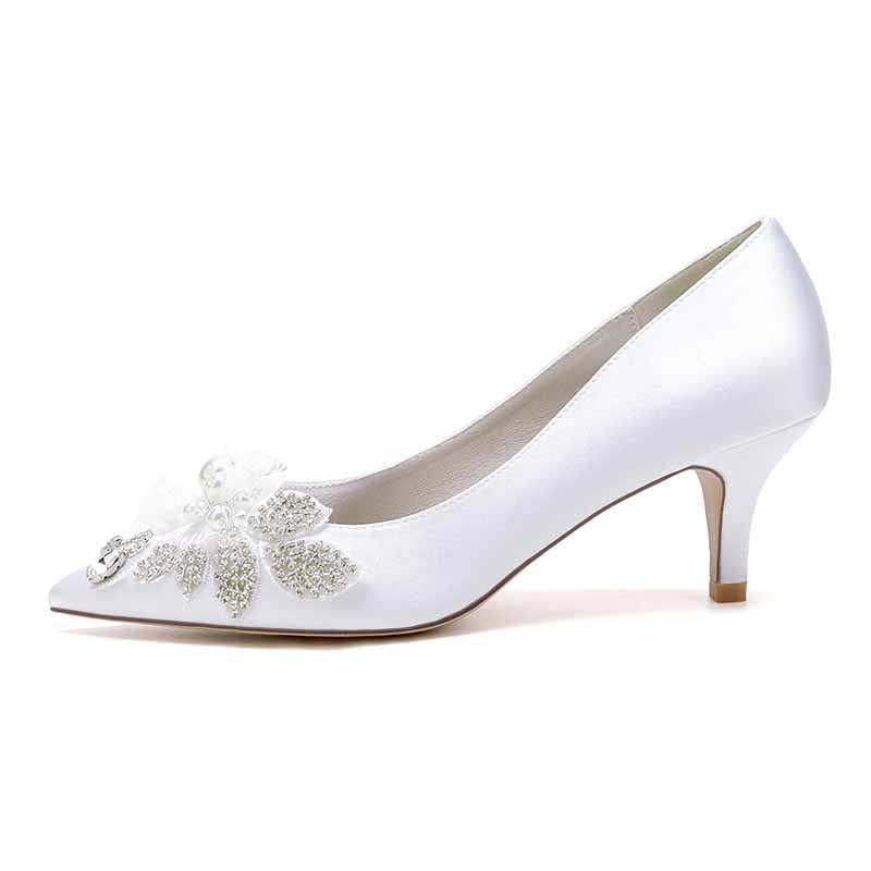pearl embellished wedding shoes in white satin with floral details and a graceful heel
