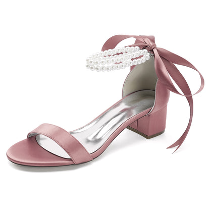 Pearl lace-up bridal sandals in pink satin with a block heel and bow detail