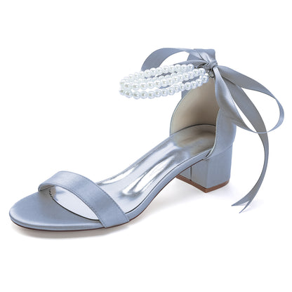 Elegant pearl lace-up bridal sandals in blue with a versatile block heel and stylish bow detail