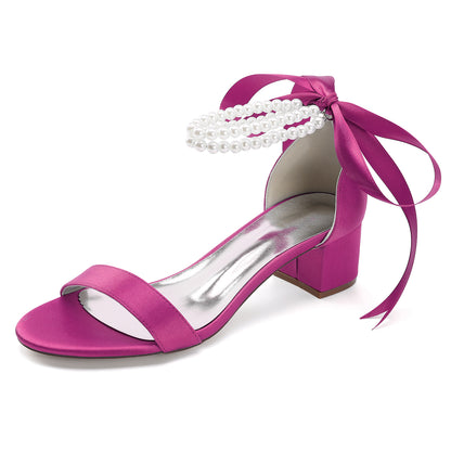 Stylish pink pearl lace-up bridal sandals with elegant pearl detailing and block heel