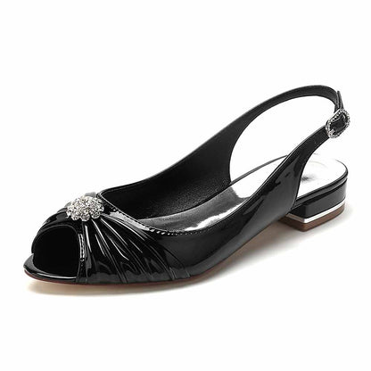 Elegant peep toe patent leather party flats by S&DCo with a jeweled embellishment