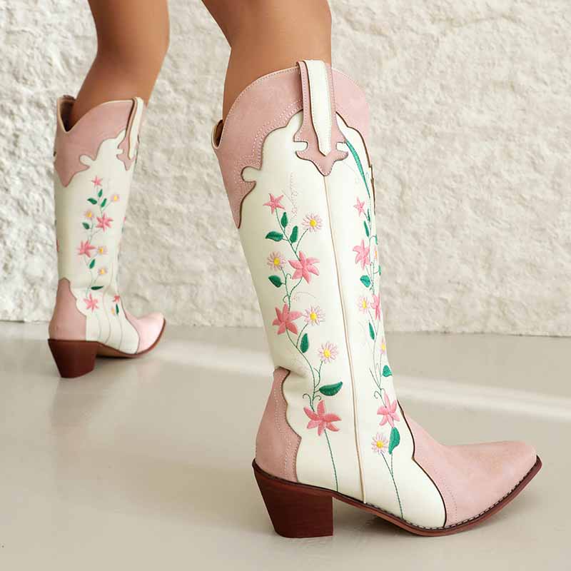 Stylish pink embroidered cowgirl boots with floral designs and a sturdy heel for Western flair