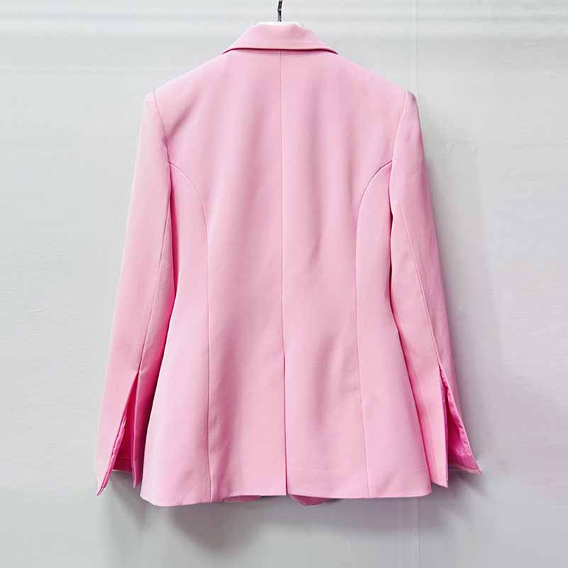 Back view of a stylish pink women's pantsuit for wedding with tailored fit and sharp lapels