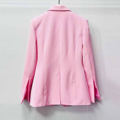 Back view of a stylish pink women's pantsuit for wedding with tailored fit and sharp lapels