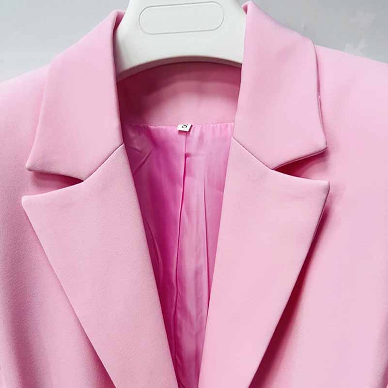 Elegant pink women's pantsuit for wedding featuring a sophisticated blazer and smooth lining