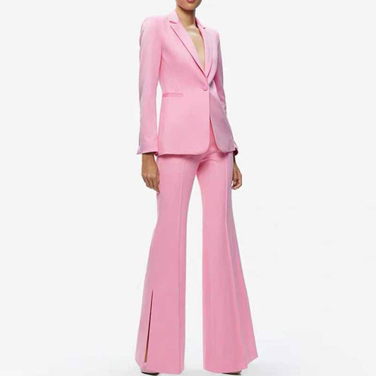 Stylish pink women's pantsuit for wedding featuring flared trousers and a tailored blazer